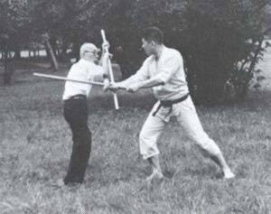 Takamatsu_Ninjutsu: Takamatsu teaching Hatsumi Bo staff techniques against sword.